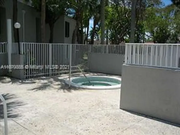 a backyard of a house with wooden floor