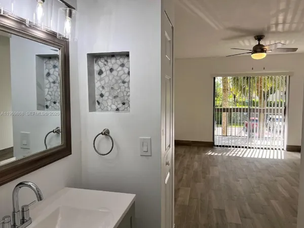 a bathroom with a sink and a mirror