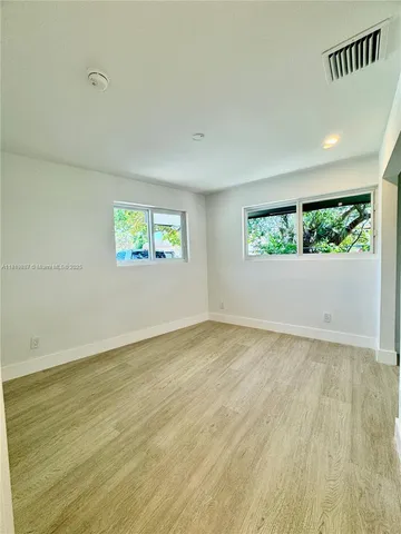 a view of an empty room and window