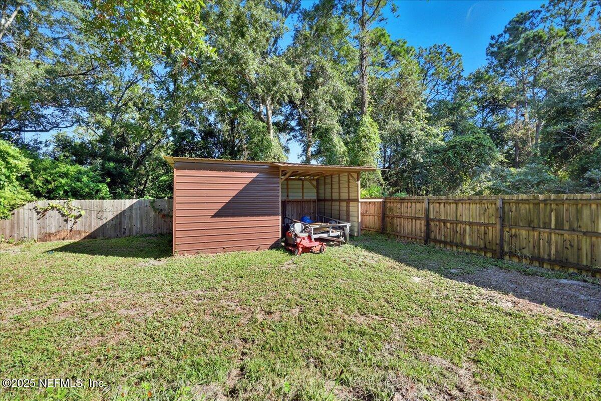 10441 Bradley Road Jacksonville, FL 32246 - Photo 17 of 19 17-Backyard & Storage