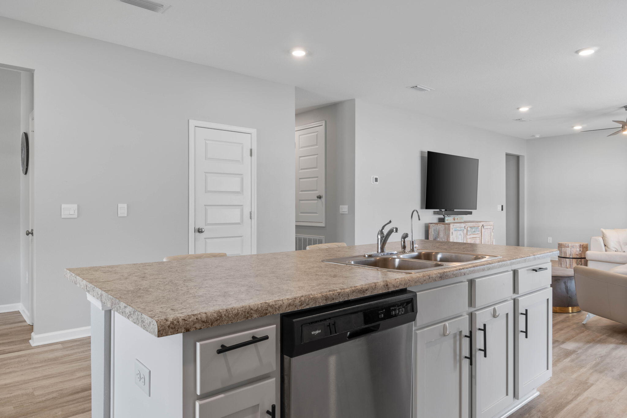 38 Silverthorn Street Freeport, FL 32439 - Photo 13 of 42 a kitchen with a sink a microwave and wooden floor