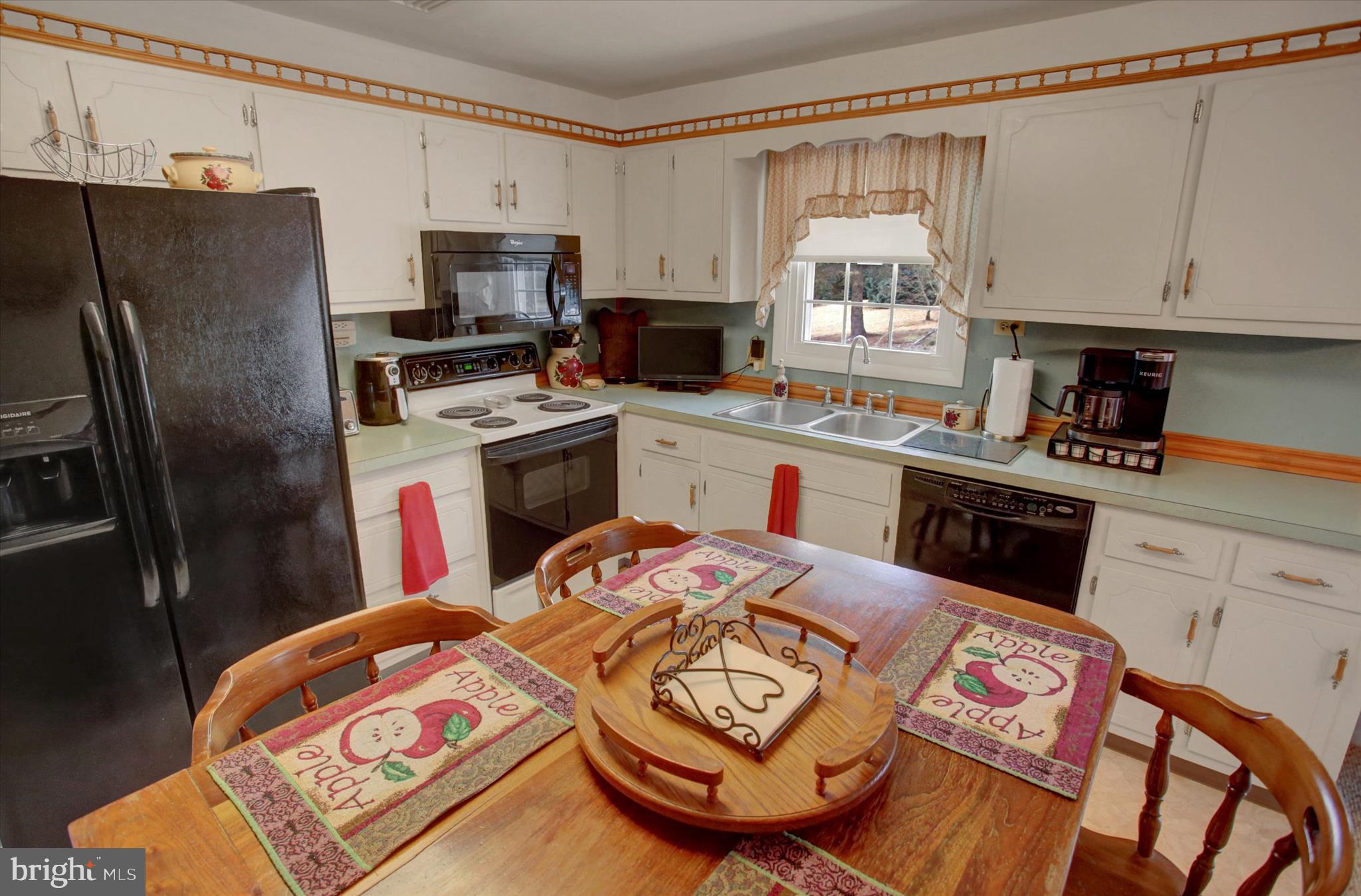 600 Shippensburg Road Shippensburg, PA 17257 - Photo 13 of 61 a kitchen with stainless steel appliances granite countertop a sink a stove a refrigerator and cabinets