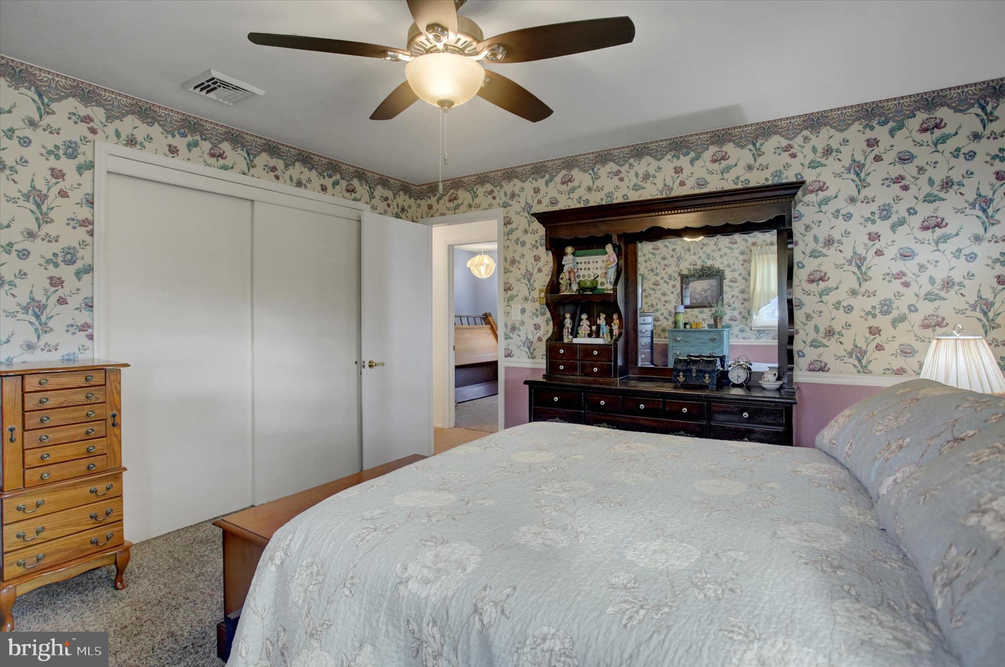 600 Shippensburg Road Shippensburg, PA 17257 - Photo 19 of 61 a bedroom with a large bed and a chandelier