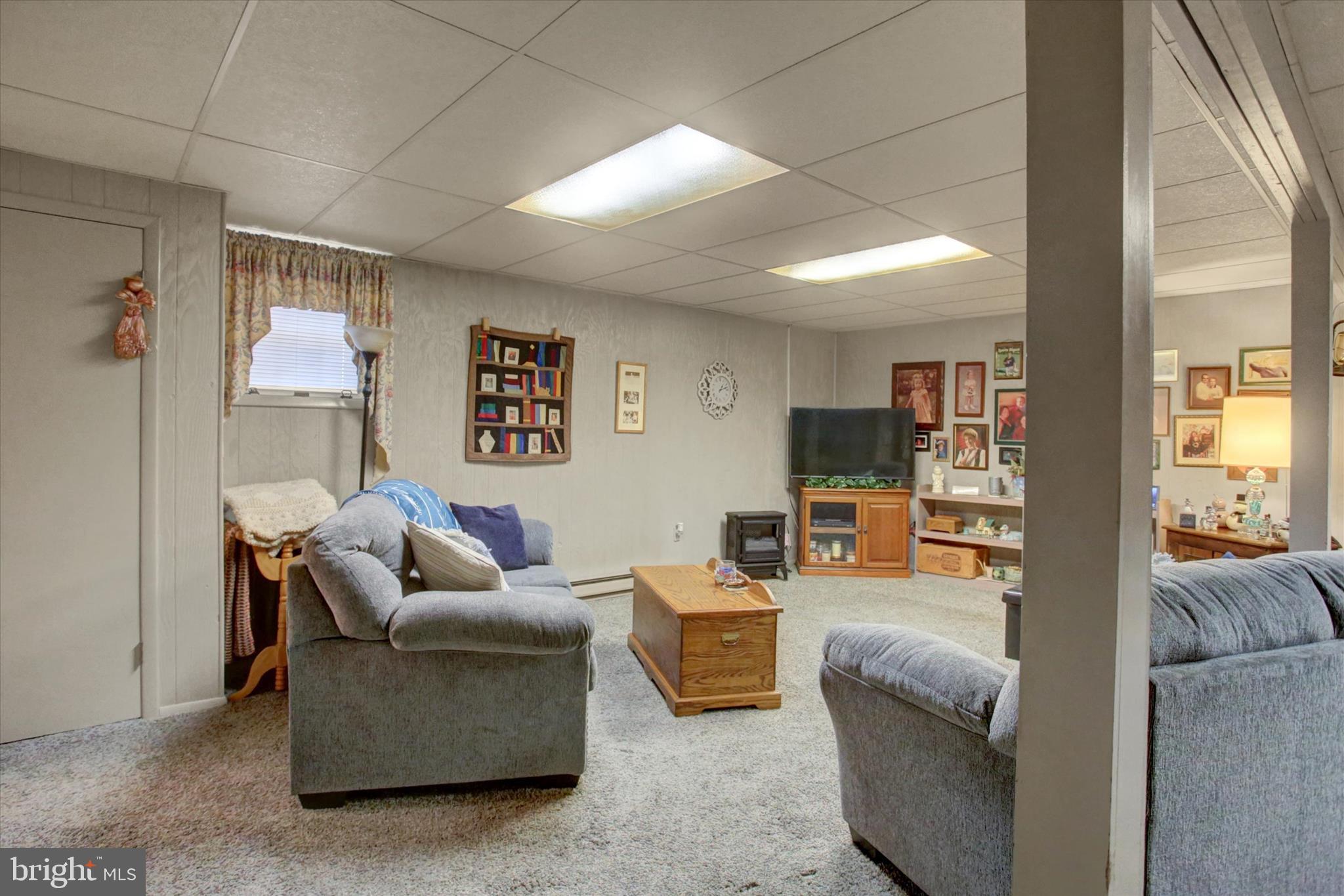 600 Shippensburg Road Shippensburg, PA 17257 - Photo 25 of 61 a living room with furniture and a flat screen tv