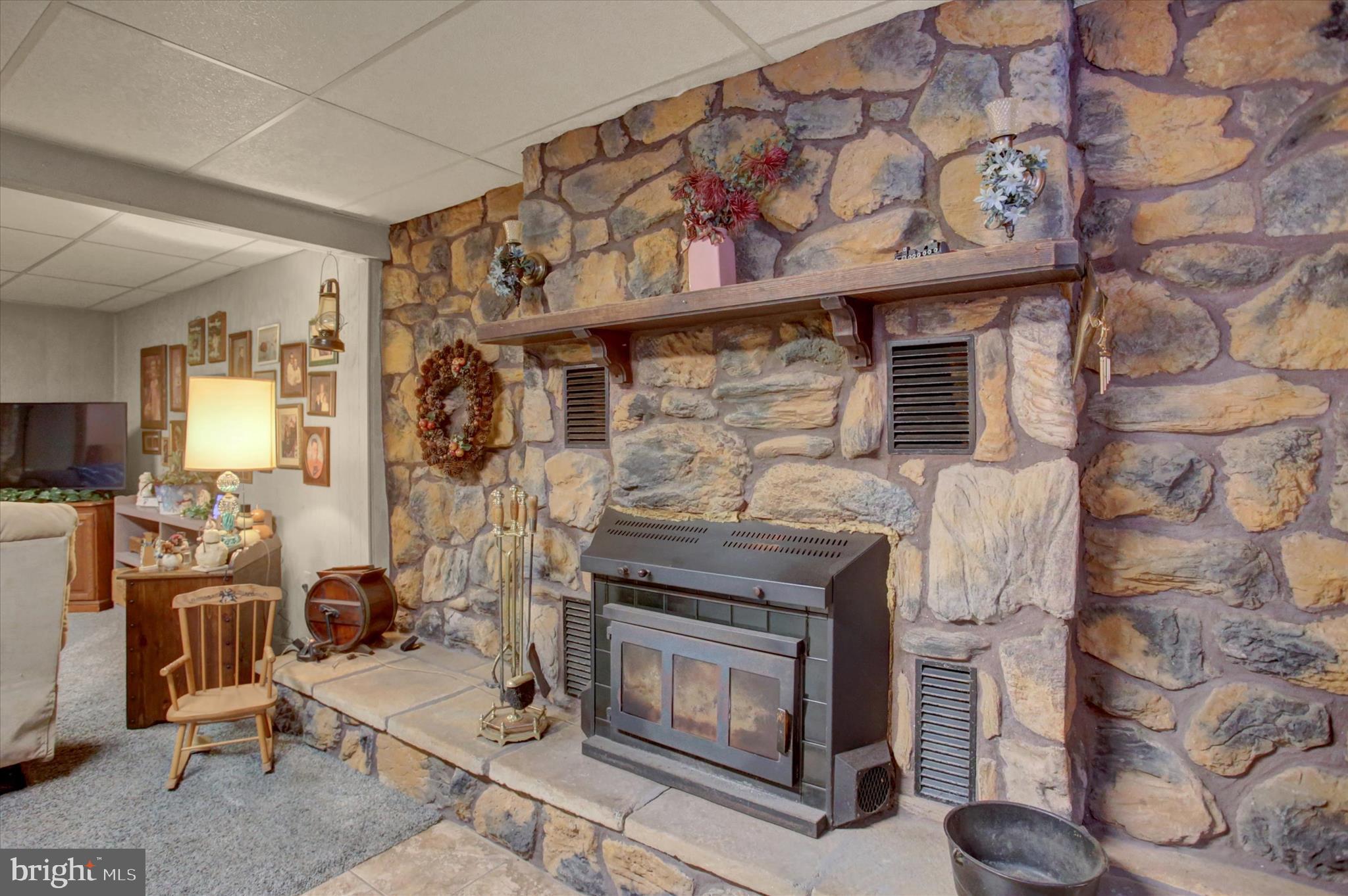 600 Shippensburg Road Shippensburg, PA 17257 - Photo 27 of 61 a living room with furniture a flat screen tv and a fireplace