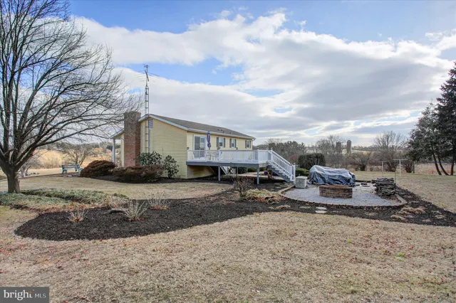 a view of a house with a snow in the background