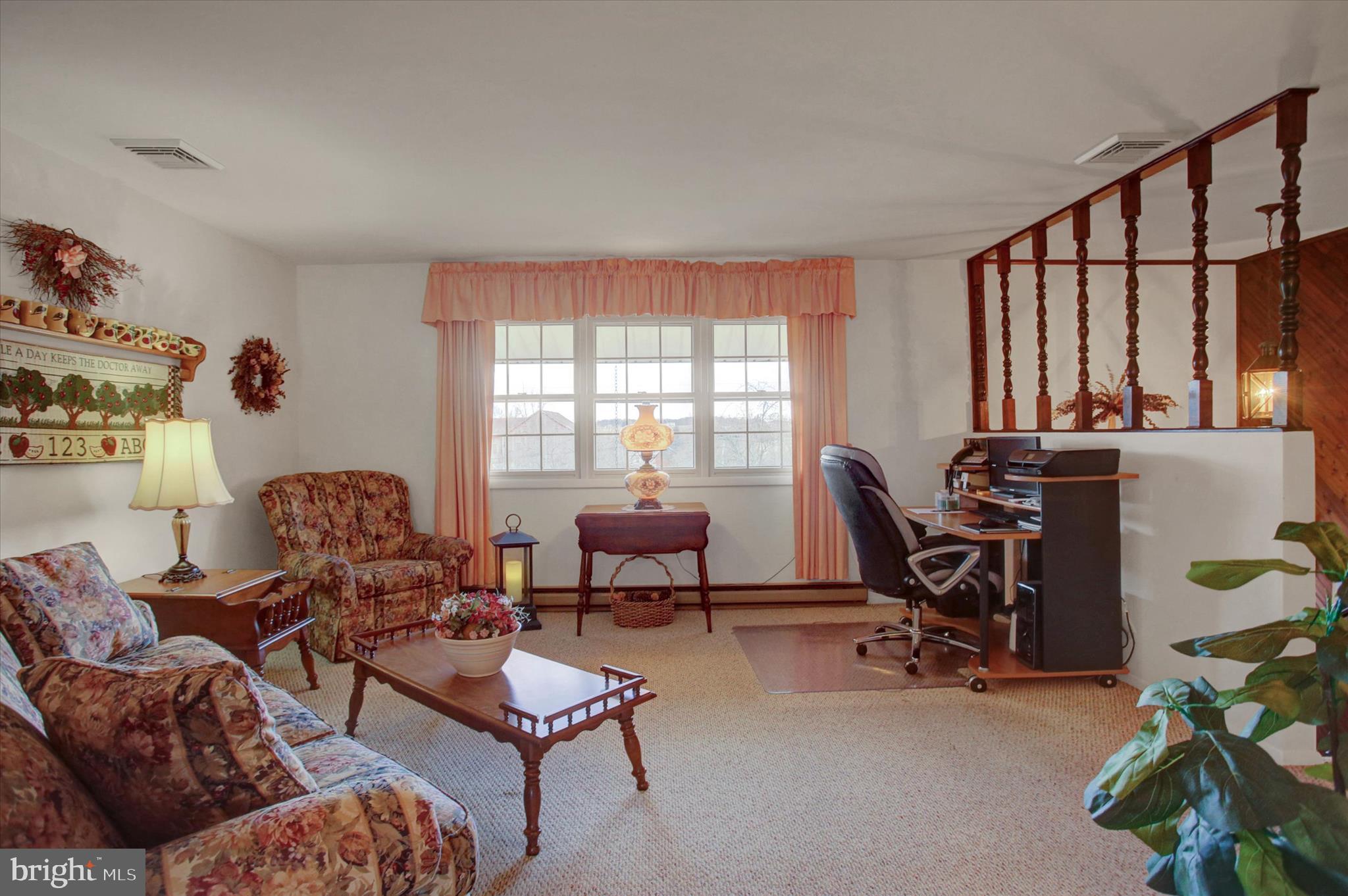 600 Shippensburg Road Shippensburg, PA 17257 - Photo 7 of 61 a living room with furniture and a window