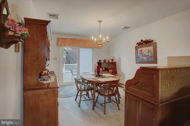 a kitchen with stainless steel appliances granite countertop a stove refrigerator and a stove