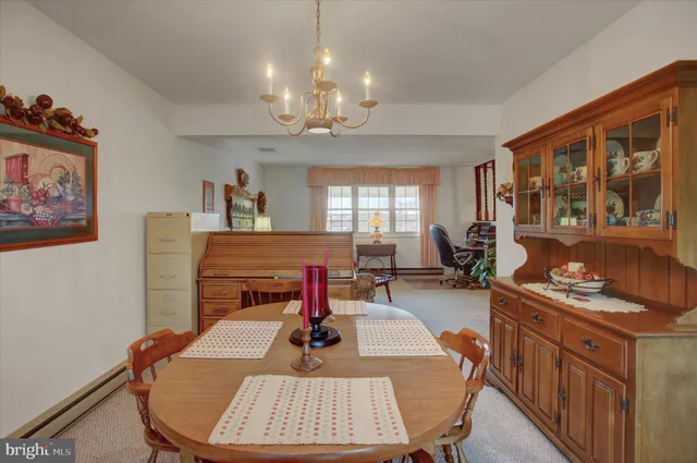a kitchen that has a table and chairs in it