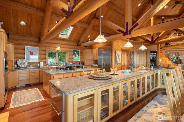 a large room with lots of counter space and chandelier