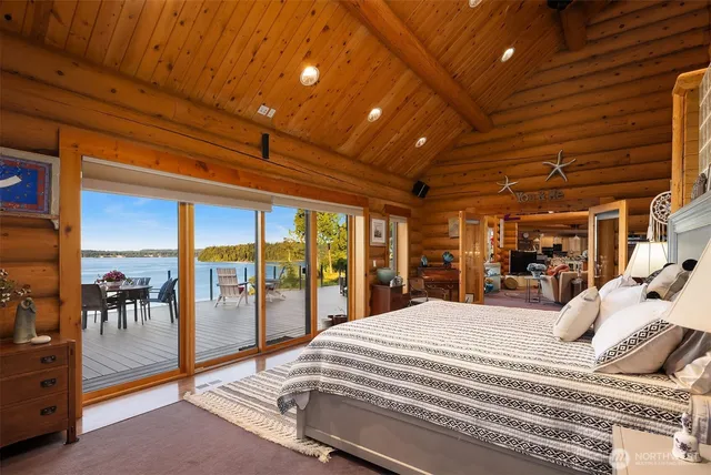 a large bedroom with a large bed and a large window