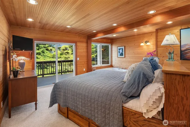 a bed room with a bed and a large window