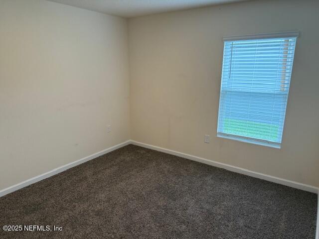 828 Morgans Treasure Road St. Augustine, FL 32084 - Photo 13 of 21 an empty room with a window