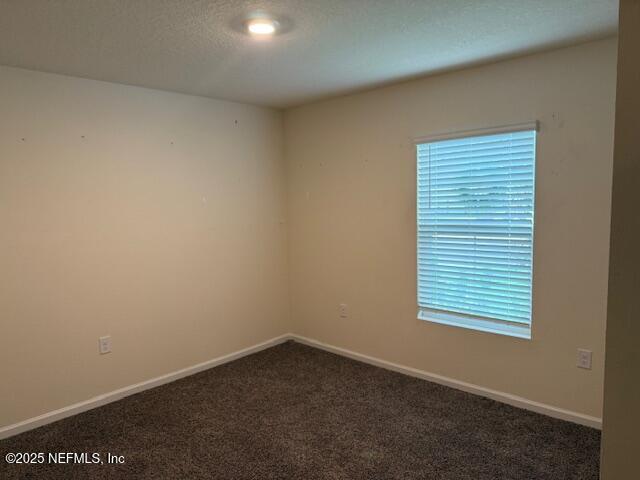 828 Morgans Treasure Road St. Augustine, FL 32084 - Photo 14 of 21 an empty room with a window