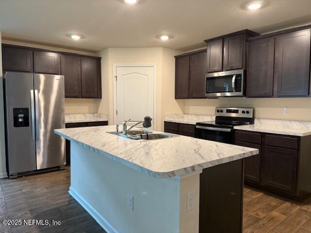 828 Morgans Treasure Road St. Augustine, FL 32084 - Photo 5 of 21 a kitchen with stainless steel appliances a sink stove refrigerator and cabinets