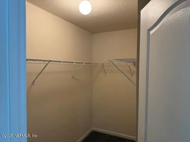 a view of a room with racks on the wall