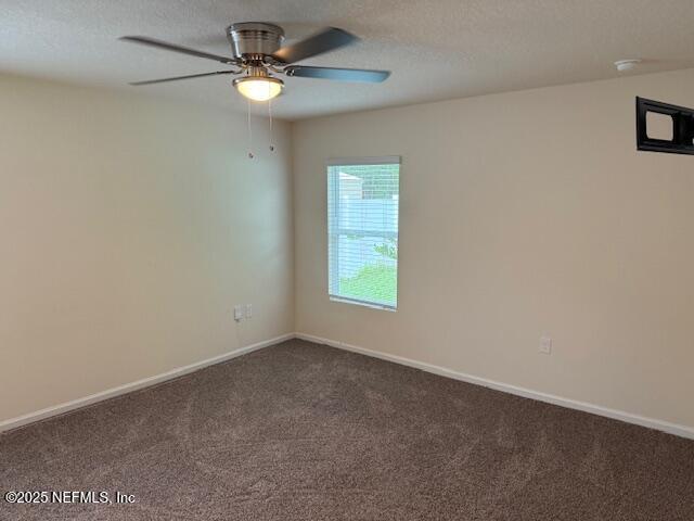 828 Morgans Treasure Road St. Augustine, FL 32084 - Photo 9 of 21 an empty room with windows and fan
