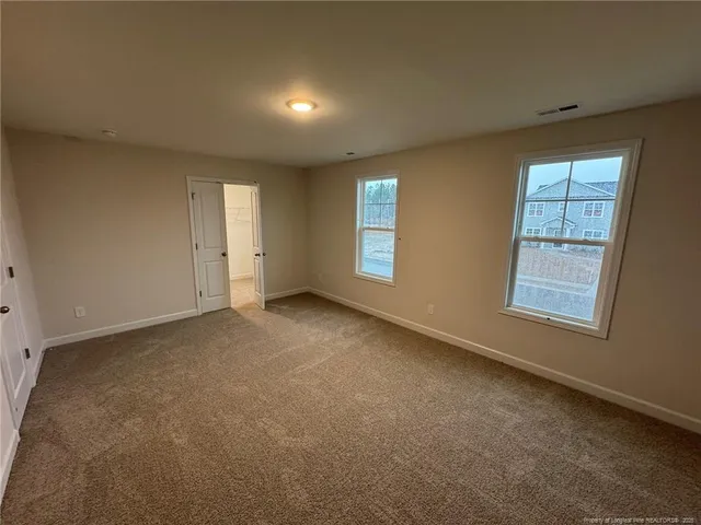 an empty room with windows