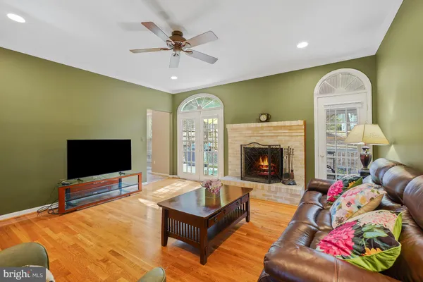 a living room with a flat screen tv and a fireplace