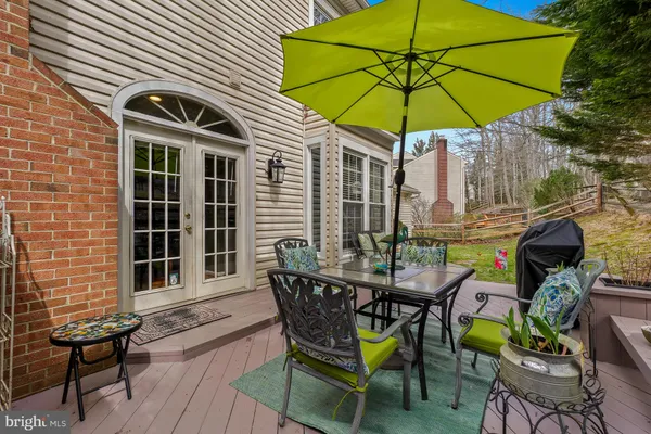 a view of a chairs and table in the balcony