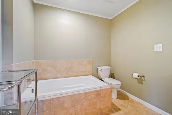 a bathroom with a bathtub and toilet