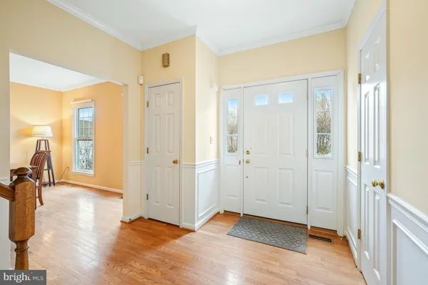 a view of a room with an empty room and glass door