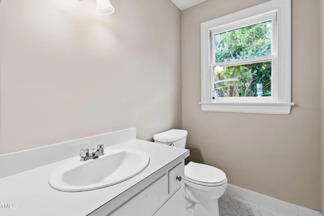 a kitchen with a stove a refrigerator and a sink