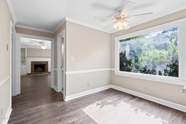 a kitchen with white cabinets stainless steel appliances and sink