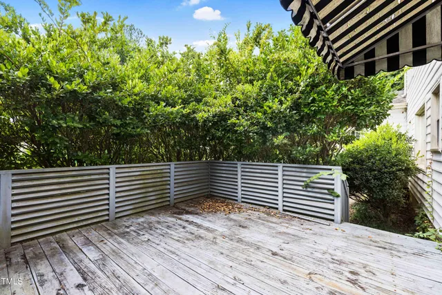 a house that has a tree in front of the house