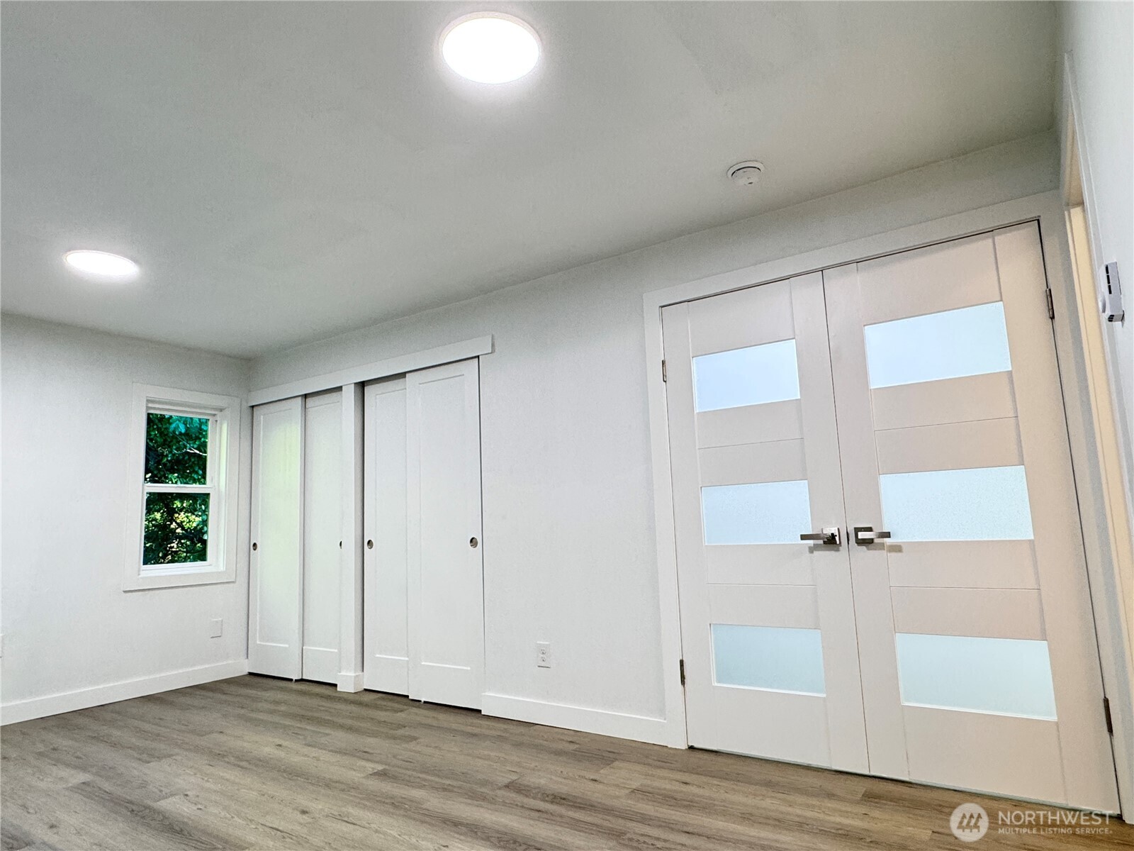 213 Willow Street Bremerton, WA 98310 - Photo 12 of 29 an empty room with wooden floor and window