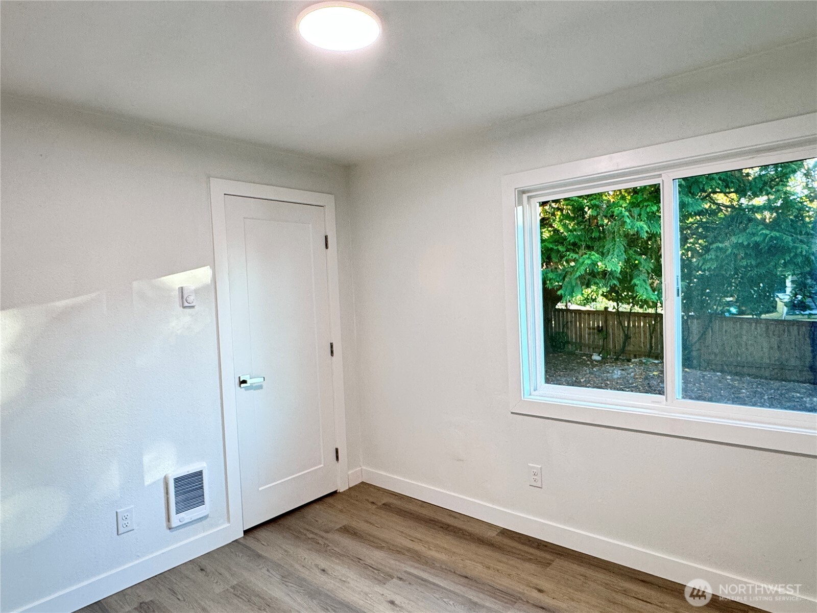 213 Willow Street Bremerton, WA 98310 - Photo 16 of 29 a view of room with window and hardwood floor