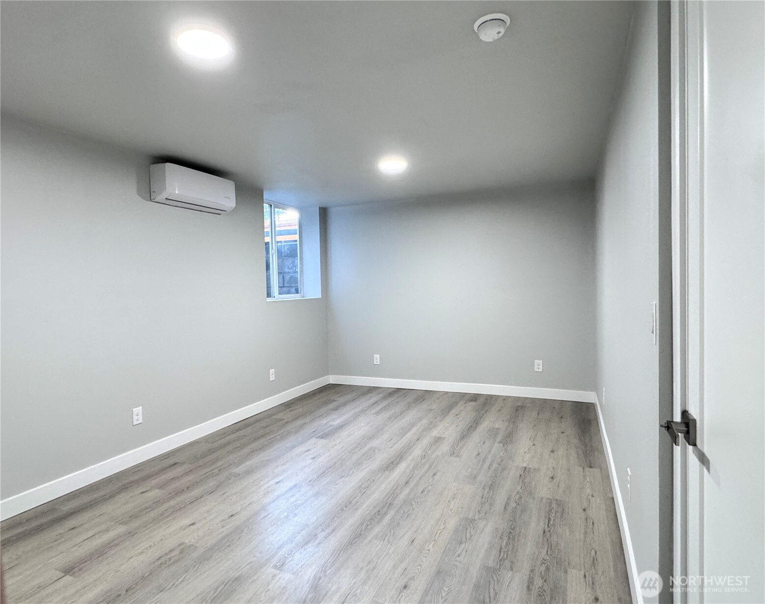 213 Willow Street Bremerton, WA 98310 - Photo 23 of 29 an empty room with wooden floor and windows