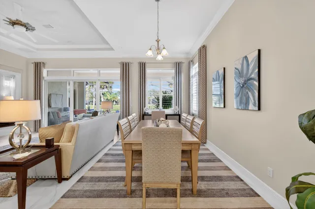 a spacious bedroom with a bed and a lamp