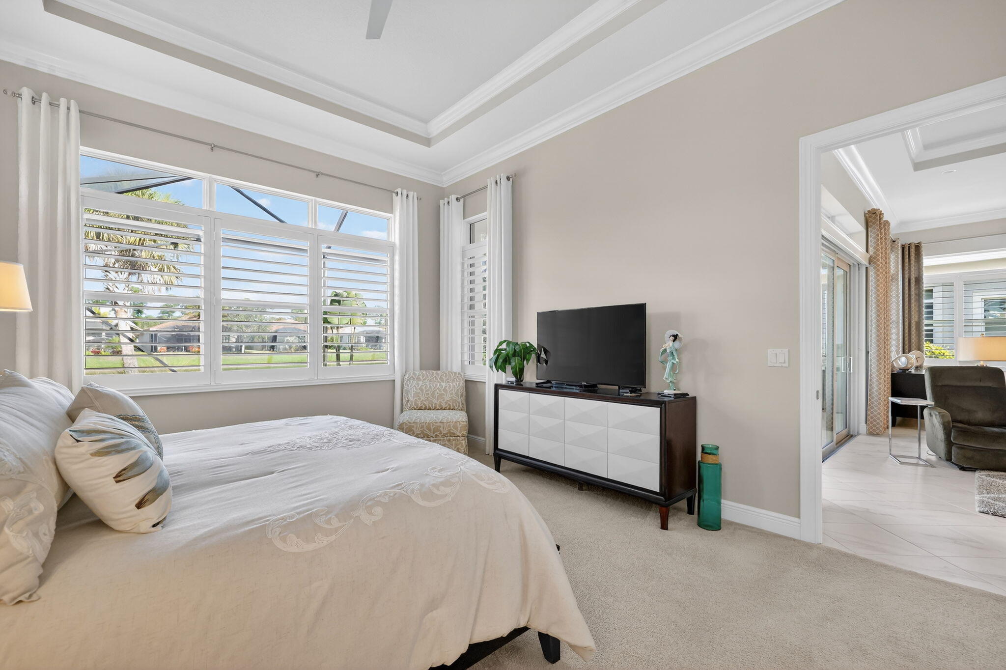 10619 Southwest Capraia Way Port St. Lucie, FL 34986 - Photo 20 of 90 a bedroom with furniture and a flat screen tv