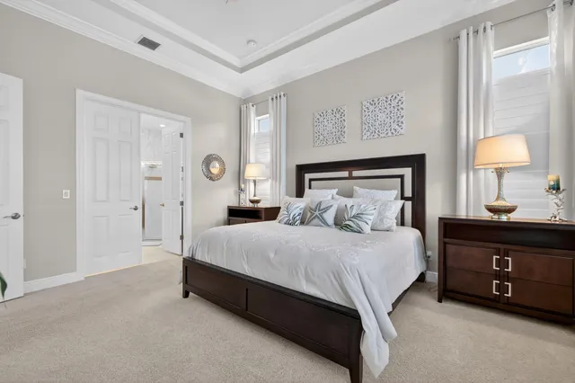 a view of a dining room with a table and chairs