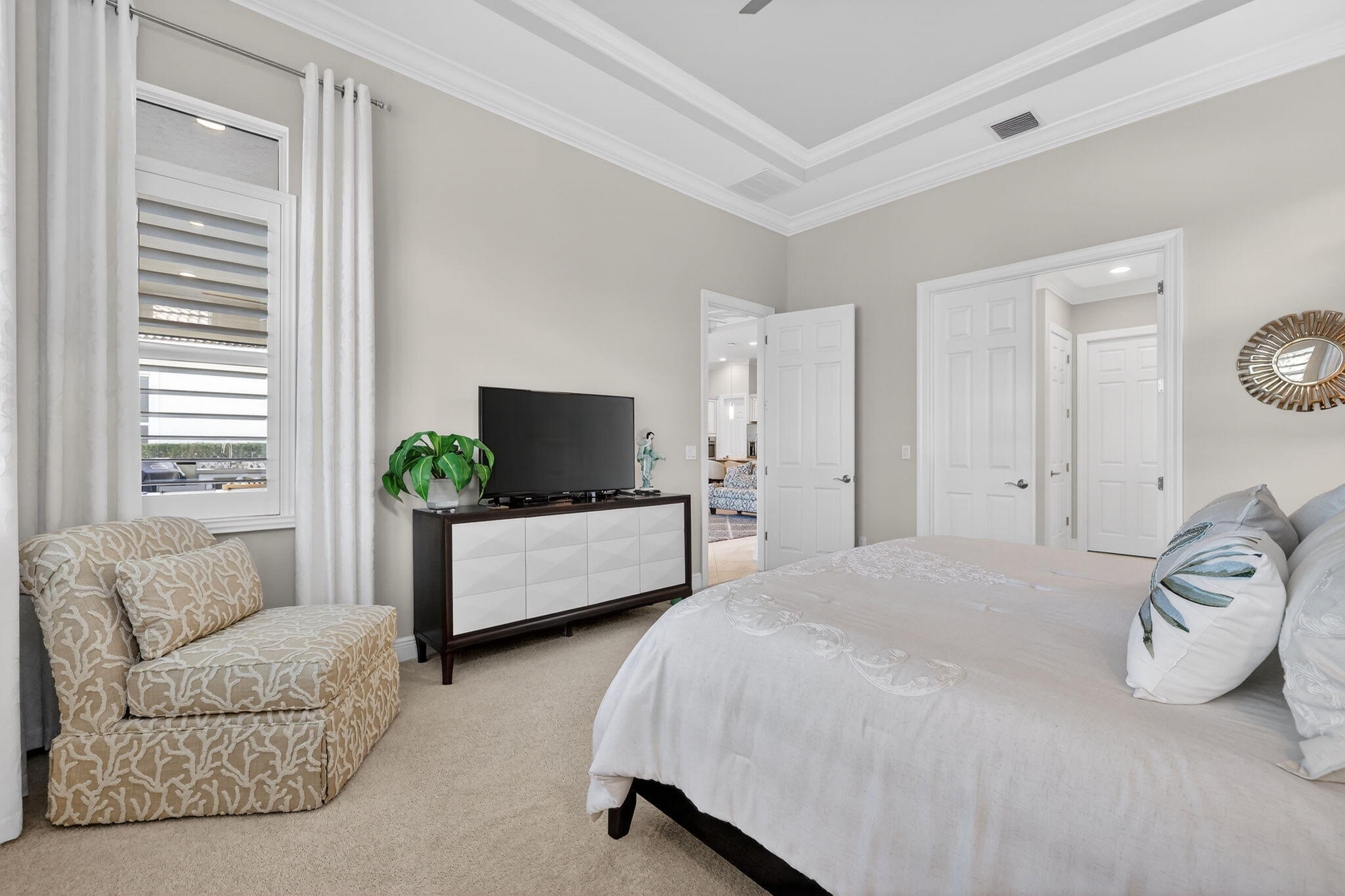 10619 Southwest Capraia Way Port St. Lucie, FL 34986 - Photo 22 of 90 a bedroom with a bed and a couch