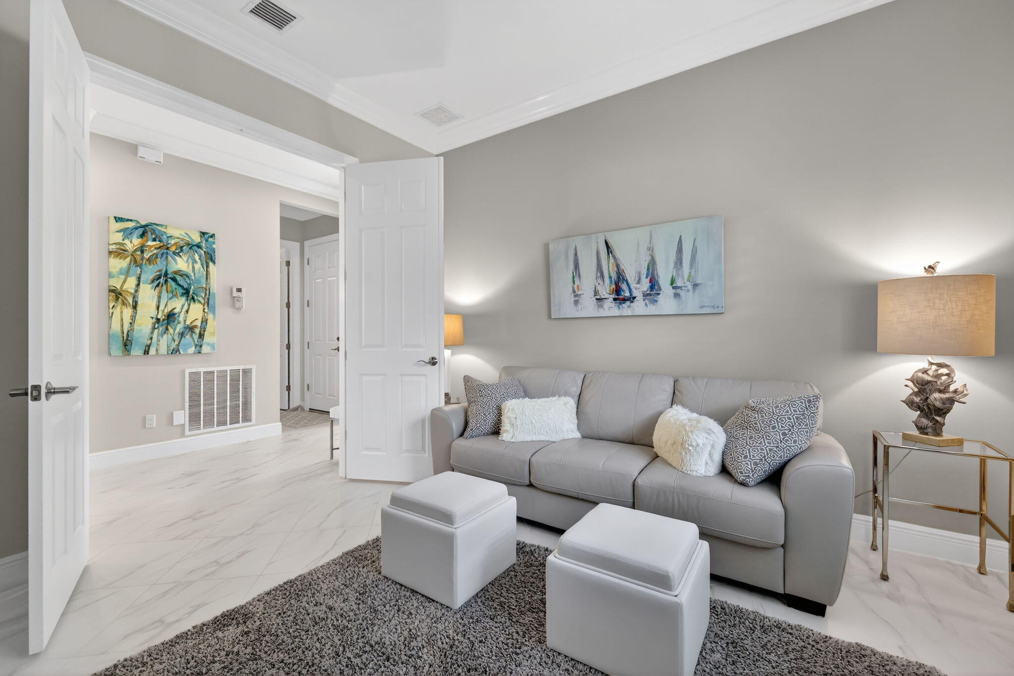 10619 Southwest Capraia Way Port St. Lucie, FL 34986 - Photo 26 of 90 a living room with furniture and a painting on the wall