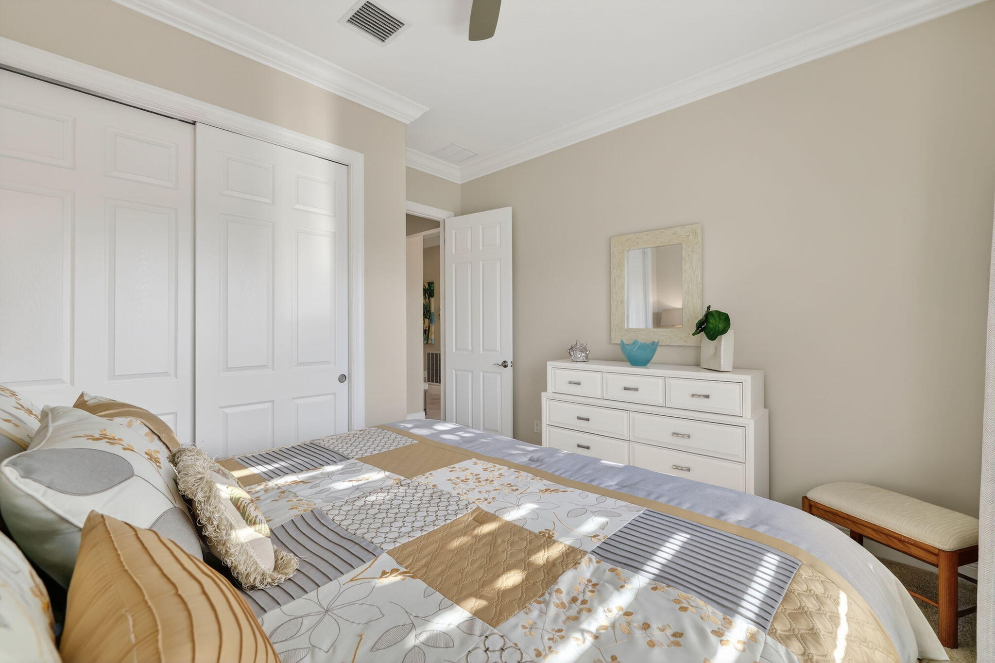 10619 Southwest Capraia Way Port St. Lucie, FL 34986 - Photo 28 of 90 a bedroom with a bed and a dresser