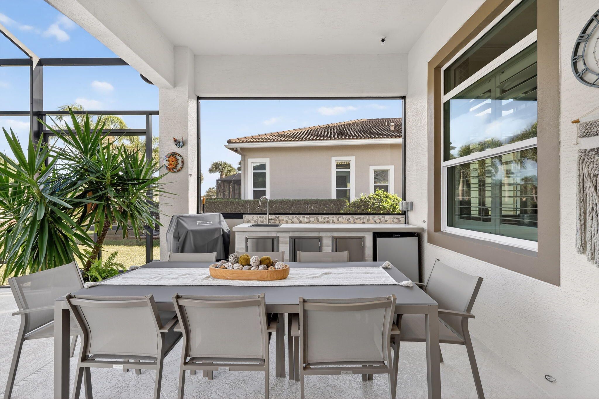 10619 Southwest Capraia Way Port St. Lucie, FL 34986 - Photo 33 of 90 a view of a dining room with a table and chairs