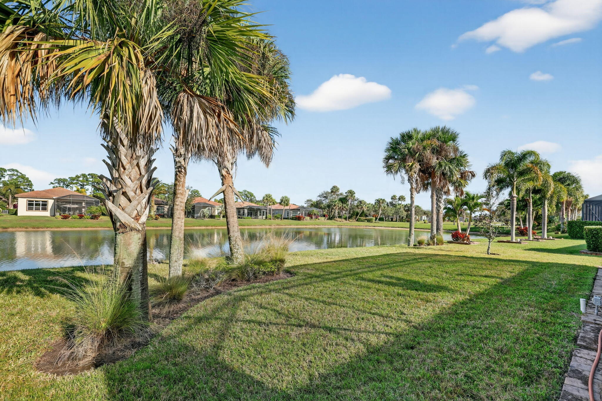 10619 Southwest Capraia Way Port St. Lucie, FL 34986 - Photo 44 of 90 a view of a lake with a big yard