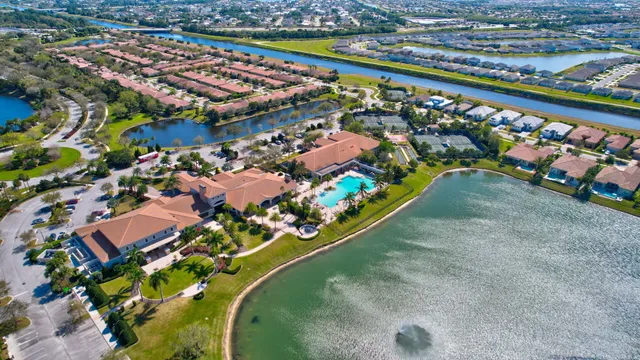 a front view of a house with a yard and fountain