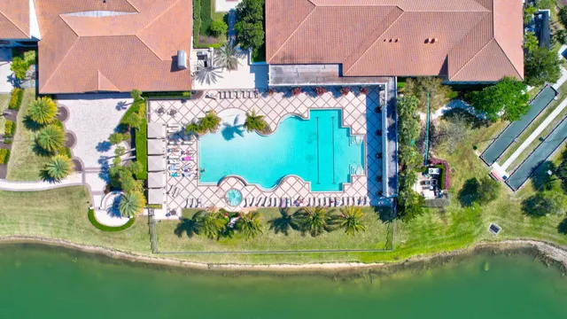 an aerial view of lake residential houses with outdoor space