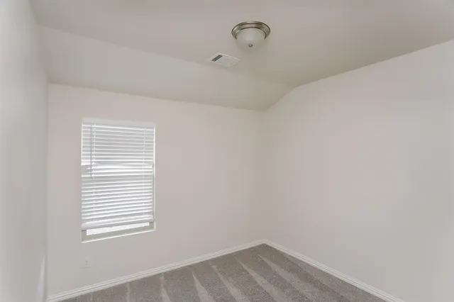 a view of a room that has a window in it