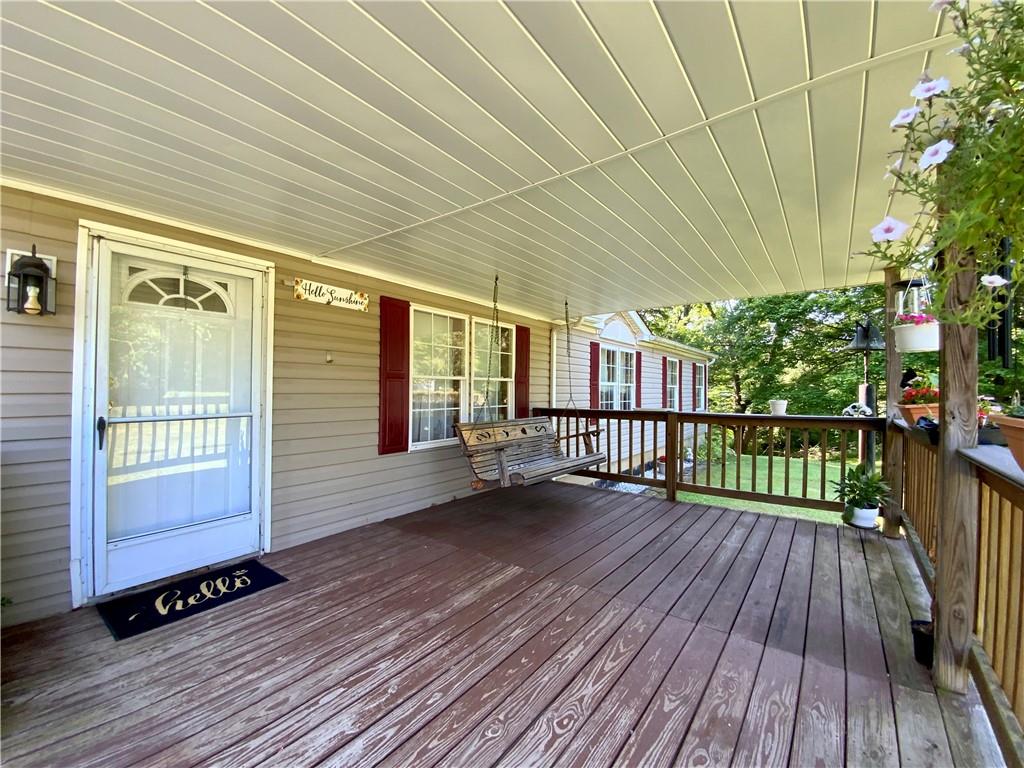 100 Fobes Drive Clinton, PA 15026 - Photo 4 of 36 a view of a balcony with wooden floor