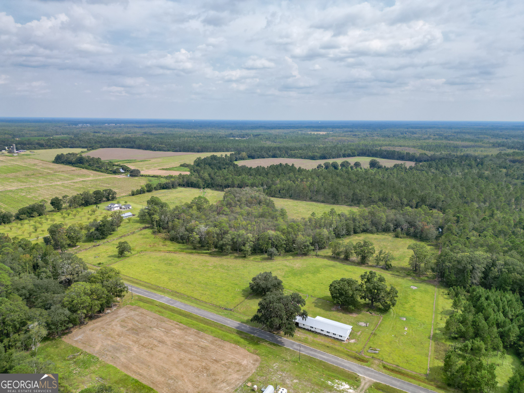 30-acres Hodges Road Hinesville, GA 31313 - Photo 16 of 34 an aerial view of a golf course with trees