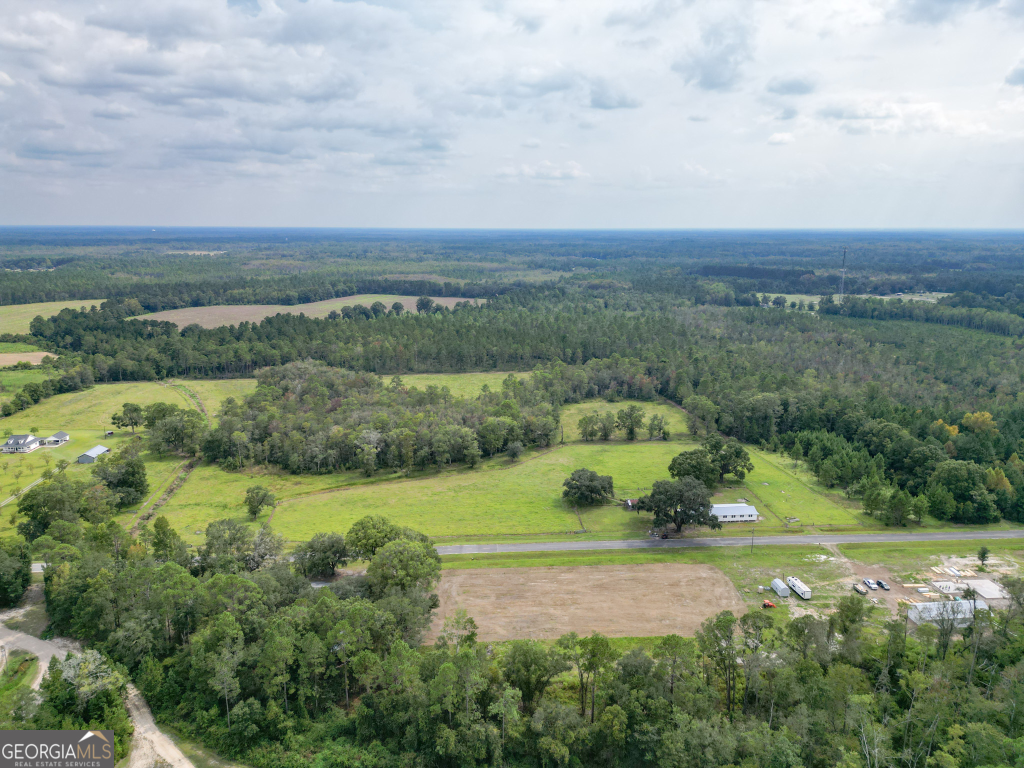 30-acres Hodges Road Hinesville, GA 31313 - Photo 18 of 34 an aerial view of a houses with trees and grass