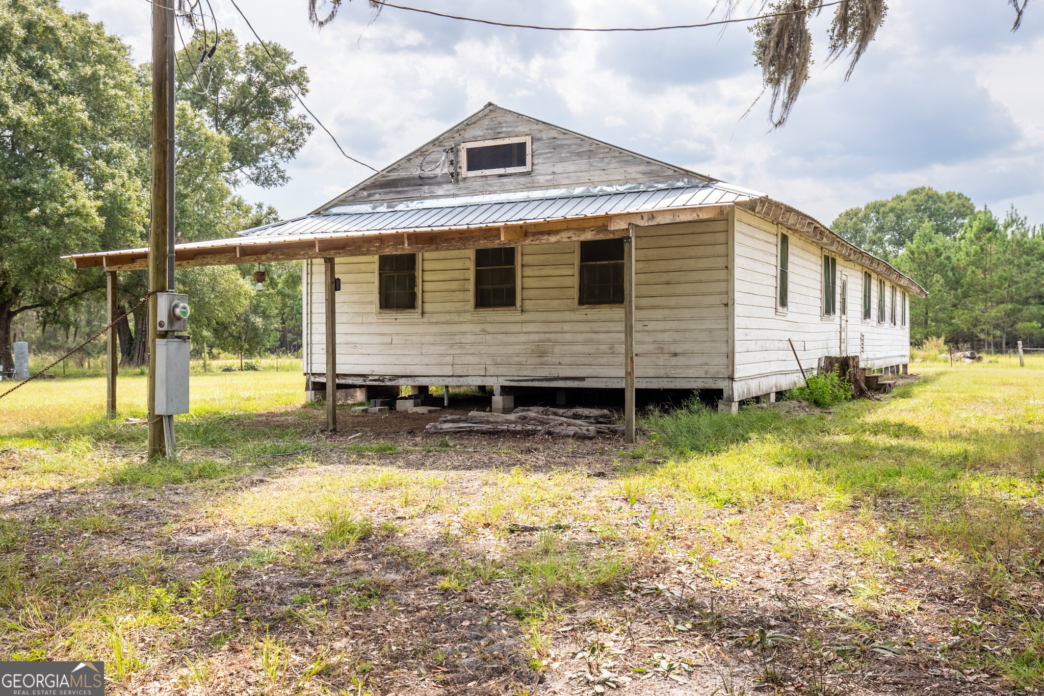 30-acres Hodges Road Hinesville, GA 31313 - Photo 19 of 34 a view of a house with a yard