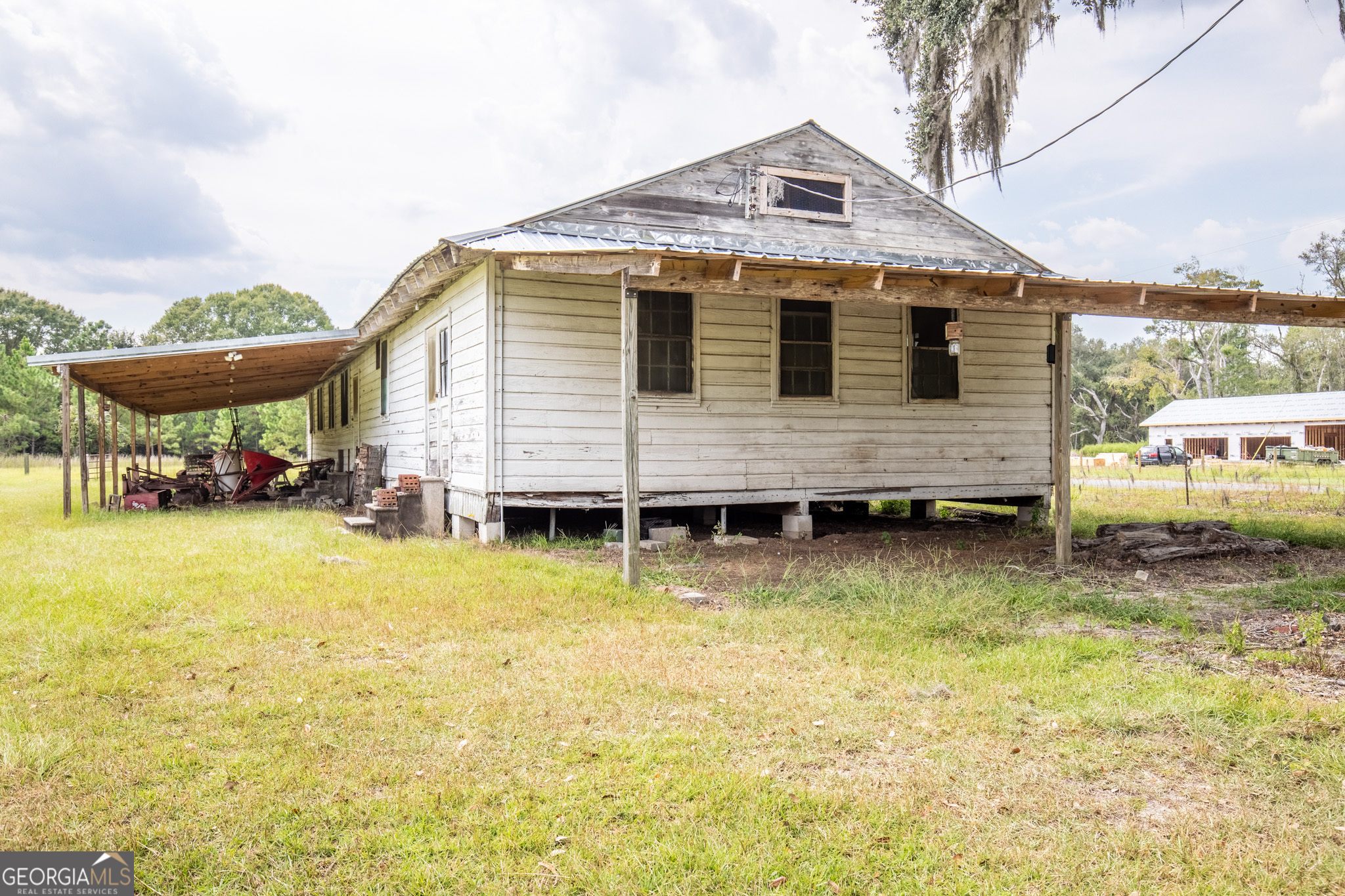 30-acres Hodges Road Hinesville, GA 31313 - Photo 20 of 34 a front view of a house with swimming pool