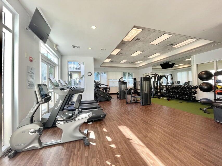 99 Southeast Mizner Boulevard, Unit 648 Boca Raton, FL 33432 - Photo 11 of 19 a view of a room with gym equipment