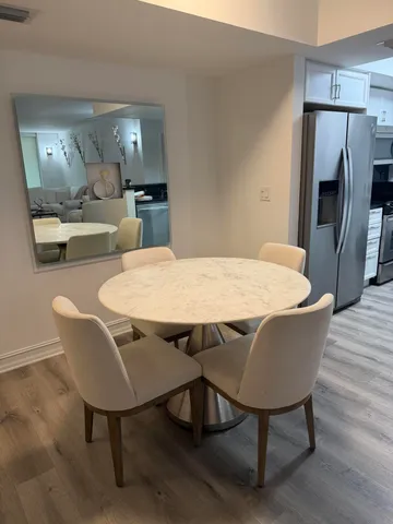 a view of a dining room with furniture